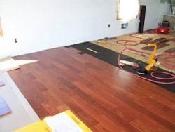 5" prefinished santos mahogany installation job site